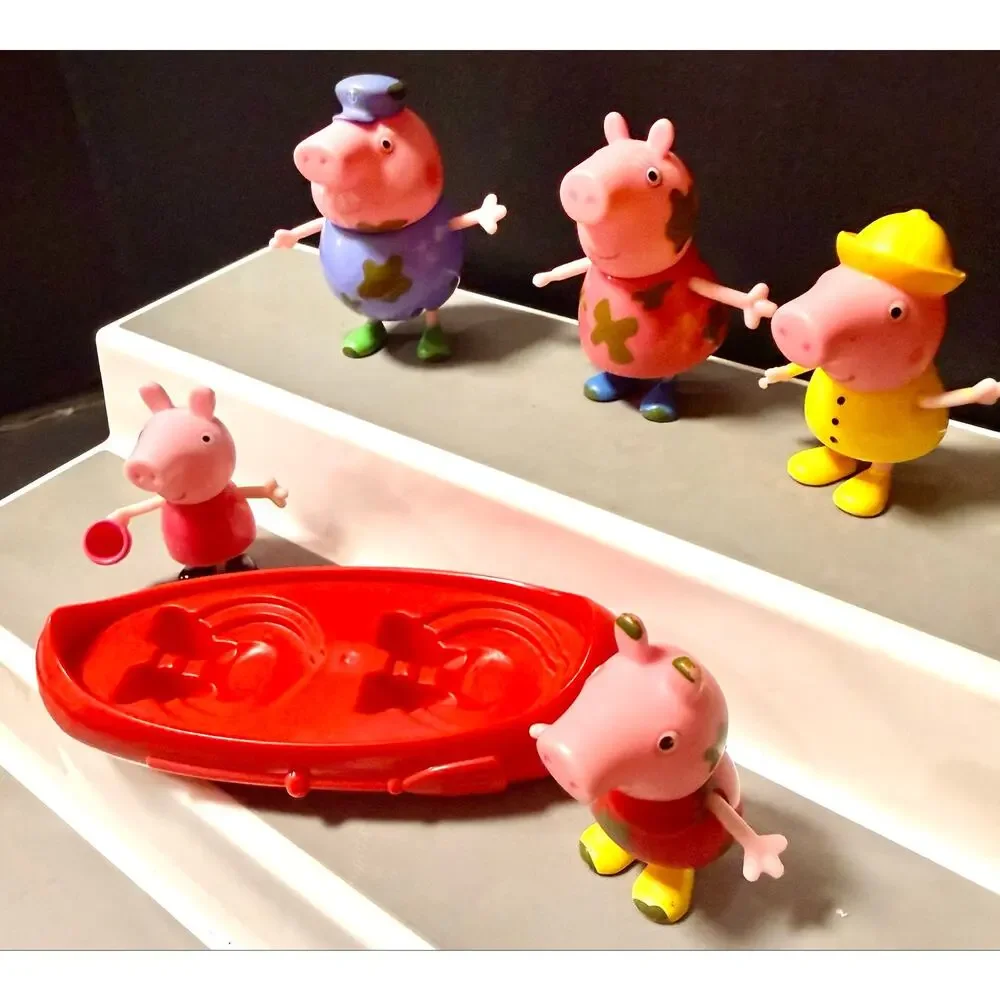 Peppa Pig Muddy Puddles figures and red canoe